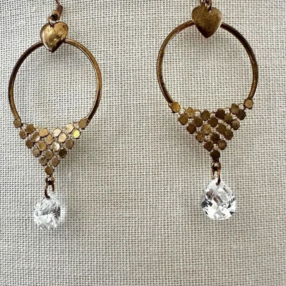 Gold tone heart crystal earrings